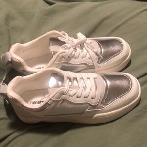 Silver, white, and gray sneakers.